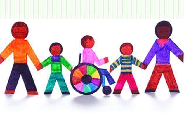 Children holding hands, one in wheel chair