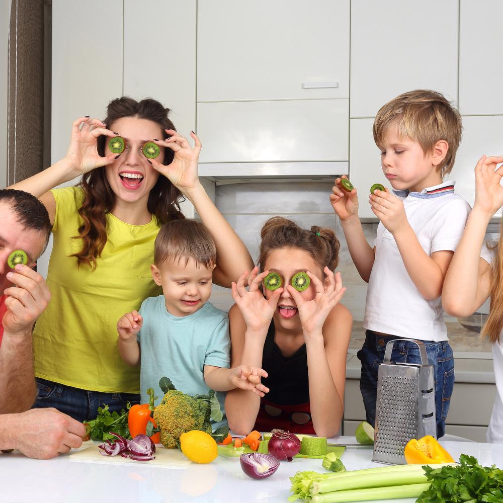 large family in kitchen being silly