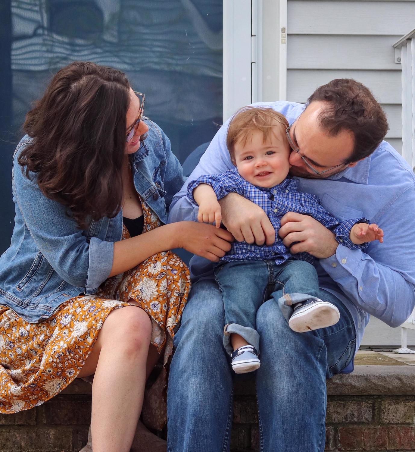 family sitting on steps 