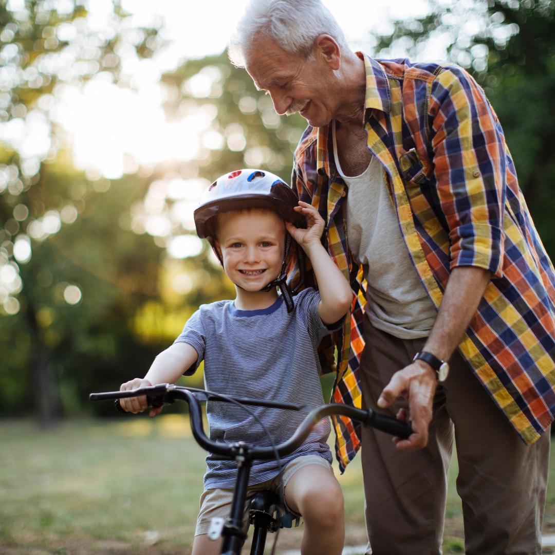 Grandpa with child on a bike