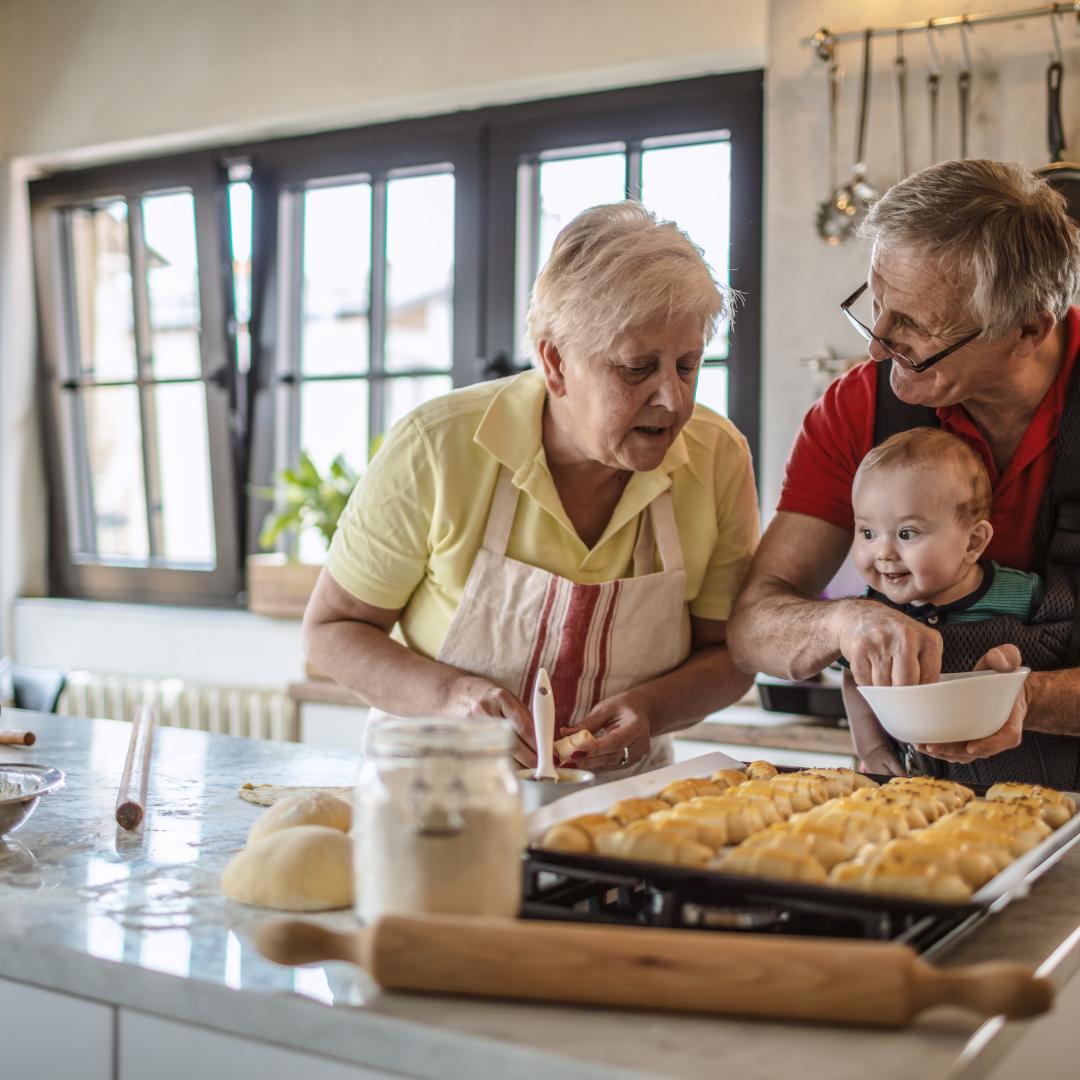 Grandparents baking with baby