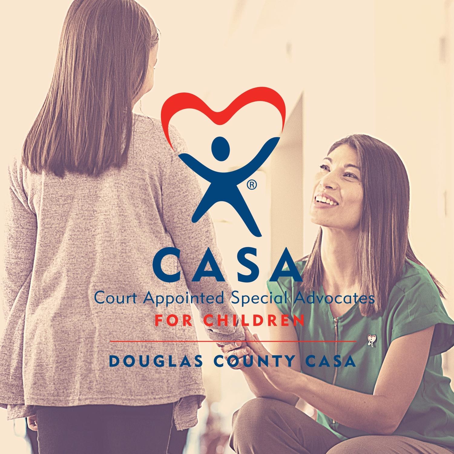 Woman holding child's hand and CASA logo