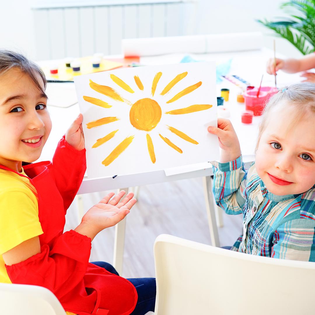 two young students painting together