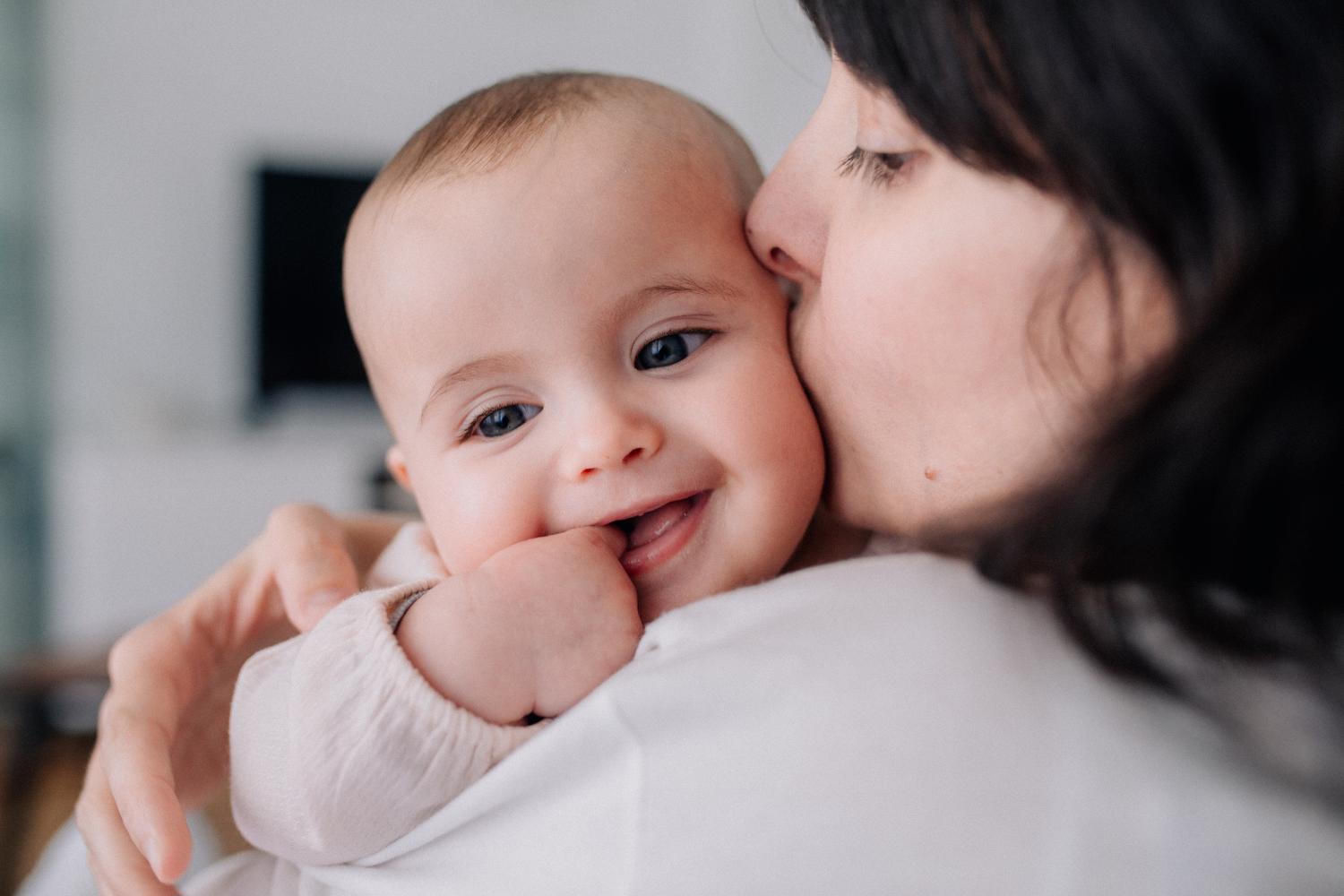 Adult holding baby 