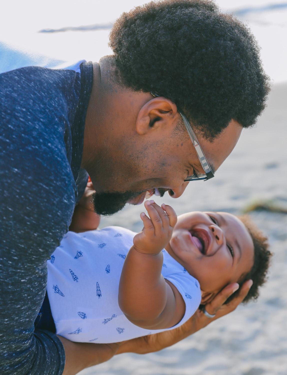 dad and baby smiling 