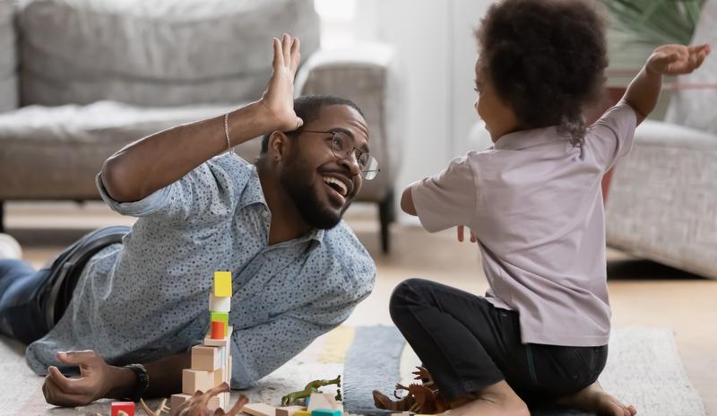 dad and child high five 