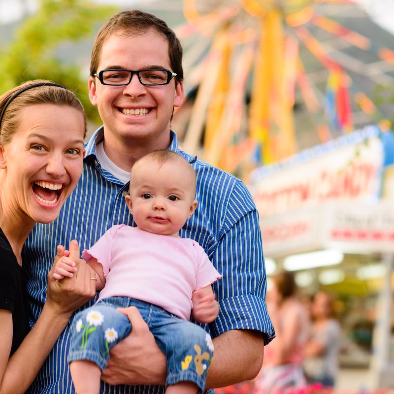 Couple with baby at fair