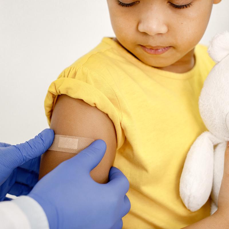 Girl getting vaccine