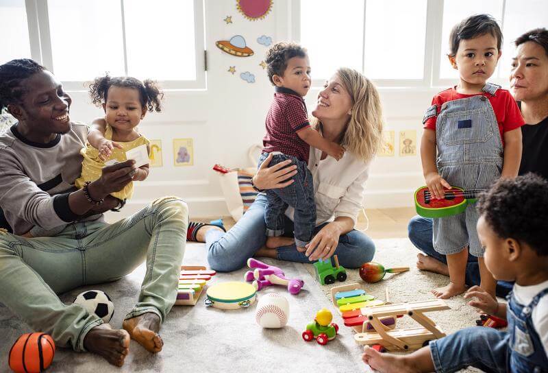 adults sitting with kids