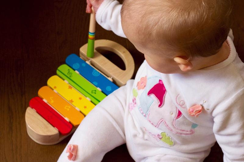 baby playing with xylophone
